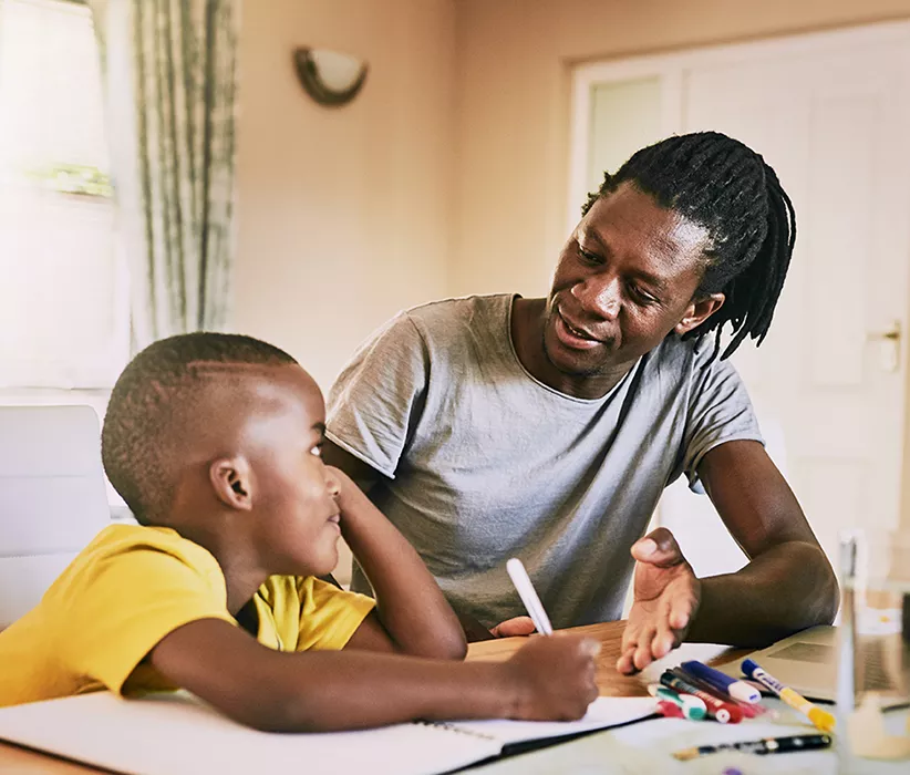 Black father and son making a plan